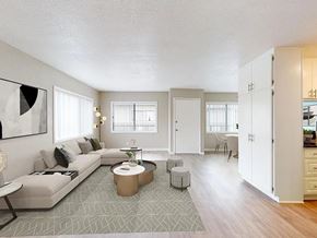 Lawndale apartment for rent - A living room with a grey couch and a coffee table.