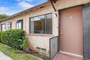 Long Beach apartment for rent - a building with a brown door and a glass window