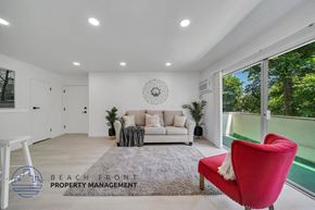 Valley Village apartment for rent - a living room with a couch and a red chair
