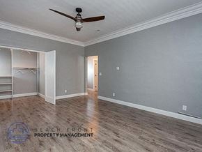 Los Angeles apartment for rent - a empty room with a ceiling fan and a wood floor