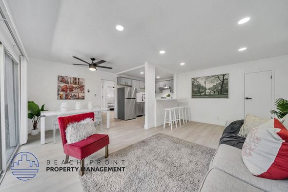Valley Village apartment for rent - a living area with a couch and a chair and a kitchen with a counter