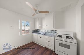 Wilmington apartment for rent - A kitchen with a stove, oven, and a fan.