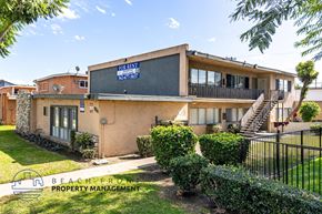 Anaheim apartment for rent - A house with a for sale sign in front of it.