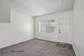 Hawthorne apartment for rent - A room with a carpeted floor and a door.