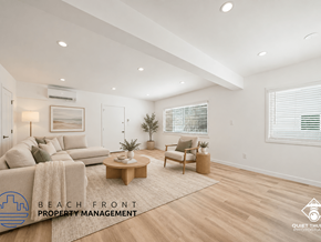 Torrance apartment for rent - A well-lit, spacious living room with a couch, chair, and coffee table.