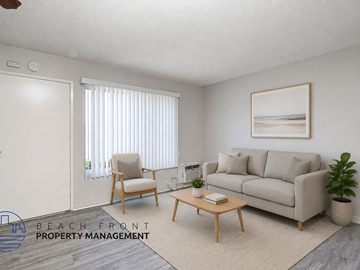 Anaheim apartment for rent - A living room with a couch, chair, and a painting on the wall.