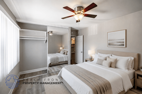 Long Beach apartment for rent - A bedroom with a large bed and a ceiling fan.