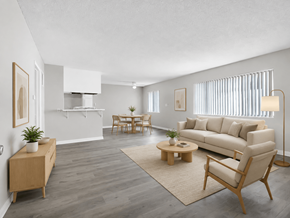 Inglewood apartment for rent - A living room with a white couch, wooden furniture, and a rug.