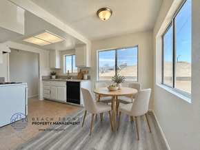 Lawndale apartment for rent - A dining room with a table set for four and a view of the beach.