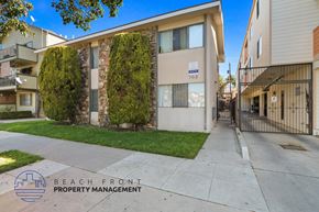 Long Beach apartment for rent - A building with the number 768 on it is shown with a clear blue sky in the background.