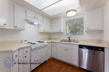 Whittier apartment for rent - A kitchen with white cabinets and a stainless steel dishwasher.