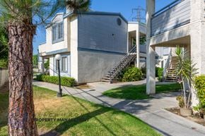 Whittier apartment for rent - A modern house with a concrete exterior and a staircase leading to the entrance.