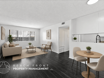 Los Angeles apartment for rent - A living room with a couch, chairs, and a table with a plant on it.