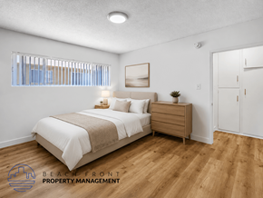 Inglewood apartment for rent - A bedroom with a bed, nightstand, and a window with blinds.