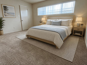 Torrance apartment for rent - A bedroom with a large bed and a window with blinds.