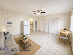 Los Angeles apartment for rent - A living room with a couch, a coffee table, and a ceiling fan.