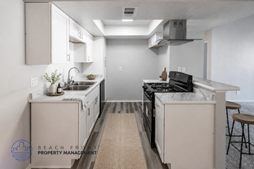Ontario apartment for rent - A kitchen with a stove top oven and a sink.