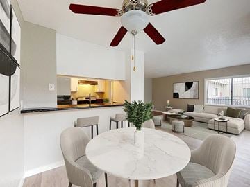 Lawndale apartment for rent - A living room with a white marble table and grey chairs.