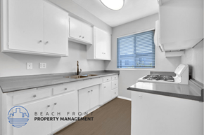 Lomita apartment for rent - an image of a kitchen with white cabinets and a sink