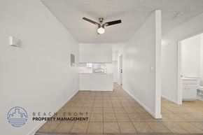 Gardena apartment for rent - A spacious room with a ceiling fan and tiled floor.