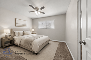 Stanton apartment for rent - A well-lit bedroom with a large bed and a ceiling fan.