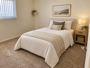 Redondo Beach apartment for rent - A bedroom with a large bed and a painting above it.