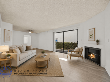 Inglewood townhouse for rent - A living room with a couch, a chair, a coffee table, and a fireplace.