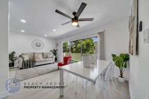 Valley Village apartment for rent - a white dining room with a white table and a ceiling fan