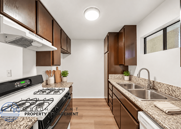 Long Beach apartment for rent - A kitchen with a stove top oven and a sink.