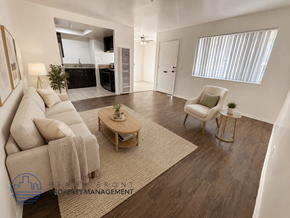 Hawthorne apartment for rent - A well-lit living room with a sofa, armchair, and coffee table.