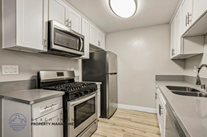 Huntington Beach apartment for rent - A kitchen with a stove, oven, microwave, and refrigerator.