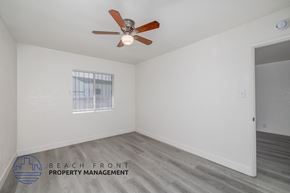 Comption apartment for rent - A room with a ceiling fan and a window.