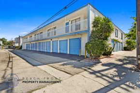 Wilmington apartment for rent - A building with a blue door is managed by Beach Front Property Management.