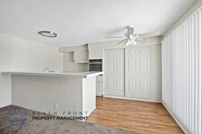 Wilmington apartment for rent - A room with a ceiling fan and a kitchenette.