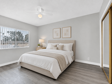 Inglewood apartment for rent - A bedroom with a large bed and a ceiling fan.