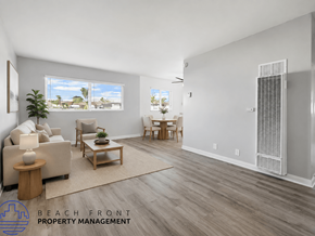 Costa Mesa apartment for rent - A living room with a couch, chairs, and a rug.