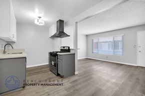 Long Beach apartment for rent - a kitchen with an island and a stove and a window