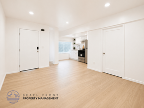 San Pedro apartment for rent - A spacious room with white doors and wooden flooring.