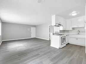 Inglewood apartment for rent - A white kitchen with a grey floor and white cabinets.