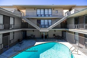Long Beach apartment for rent - A pool in a courtyard surrounded by apartment buildings.