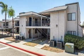 Pomona apartment for rent - A row of houses with a red line down the middle of the street.