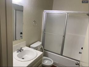 San Pedro apartment for rent - A bathroom with a sink, toilet, and shower.