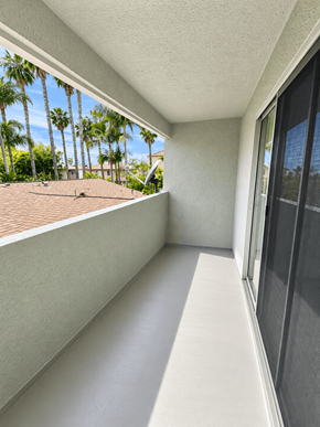 Long Beach apartment for rent - A balcony with a view of a roof and trees.