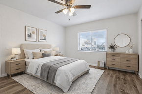 Hawthorne apartment for rent - A bedroom with a bed, dresser, and window.
