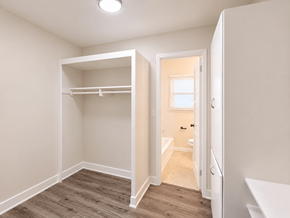 Long Beach apartment for rent - A small bedroom with a bunk bed and a doorway leading to another room.