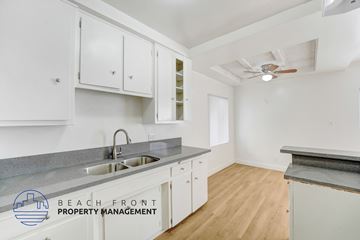 Huntington Park apartment for rent - A kitchen with a sink and a fan.