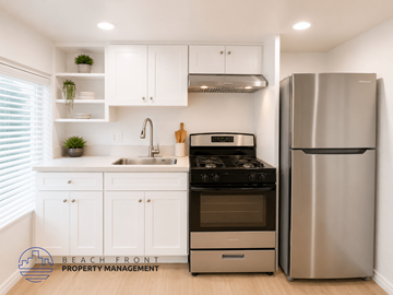 San Pedro apartment for rent - A modern kitchen with a stainless steel refrigerator and stove.