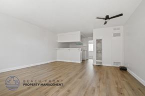 Torrance apartment for rent - A room with a ceiling fan and wooden flooring.