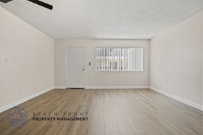 Torrance apartment for rent - A room with a door and a window with blinds.