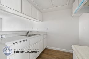 Torrance apartment for rent - A kitchen with white cabinets and a sink.